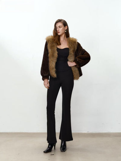Cappotto peloso con collo a contrasto