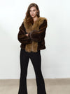 Cappotto peloso con collo a contrasto