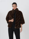 Cappotto peloso con righe diagonali e collo alto